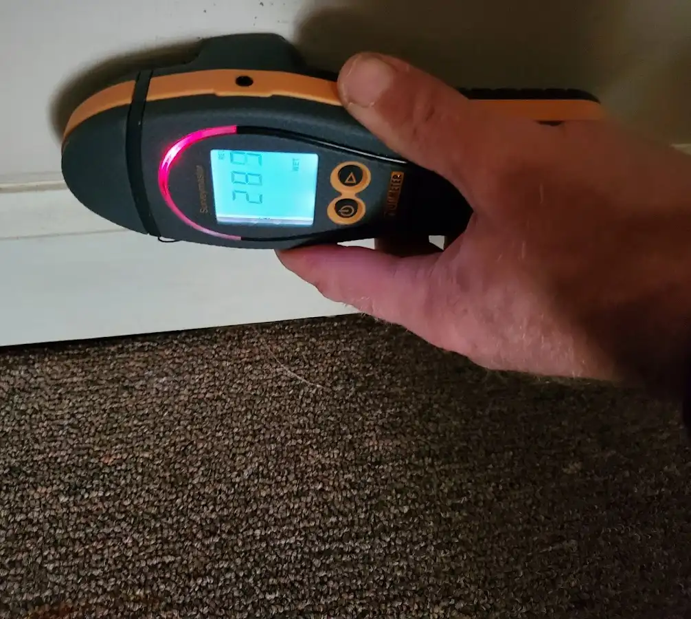 Moisture detection at baseboard during Storm Damage Restoration in Strasburg